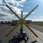 Croix lumineuse mobile indiquant la fermeture d’une piste d’aéroport